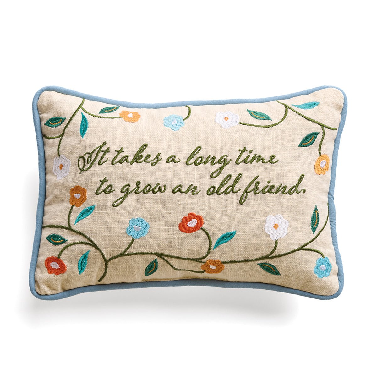 embroidered flowers on a cream background around the phrase it takes a long time to grow an old friend
